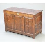 A 17th/18th Century oak coffer of panelled construction with hinged lid and brass lock plate 76cm