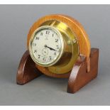 Astral, a 1930's 8 day yacht/aircraft clock with 7cm silvered dial, Arabic numerals, contained in