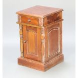 A Victorian style hardwood bedside cabinet fitted a drawer above cupboard enclosed by arched