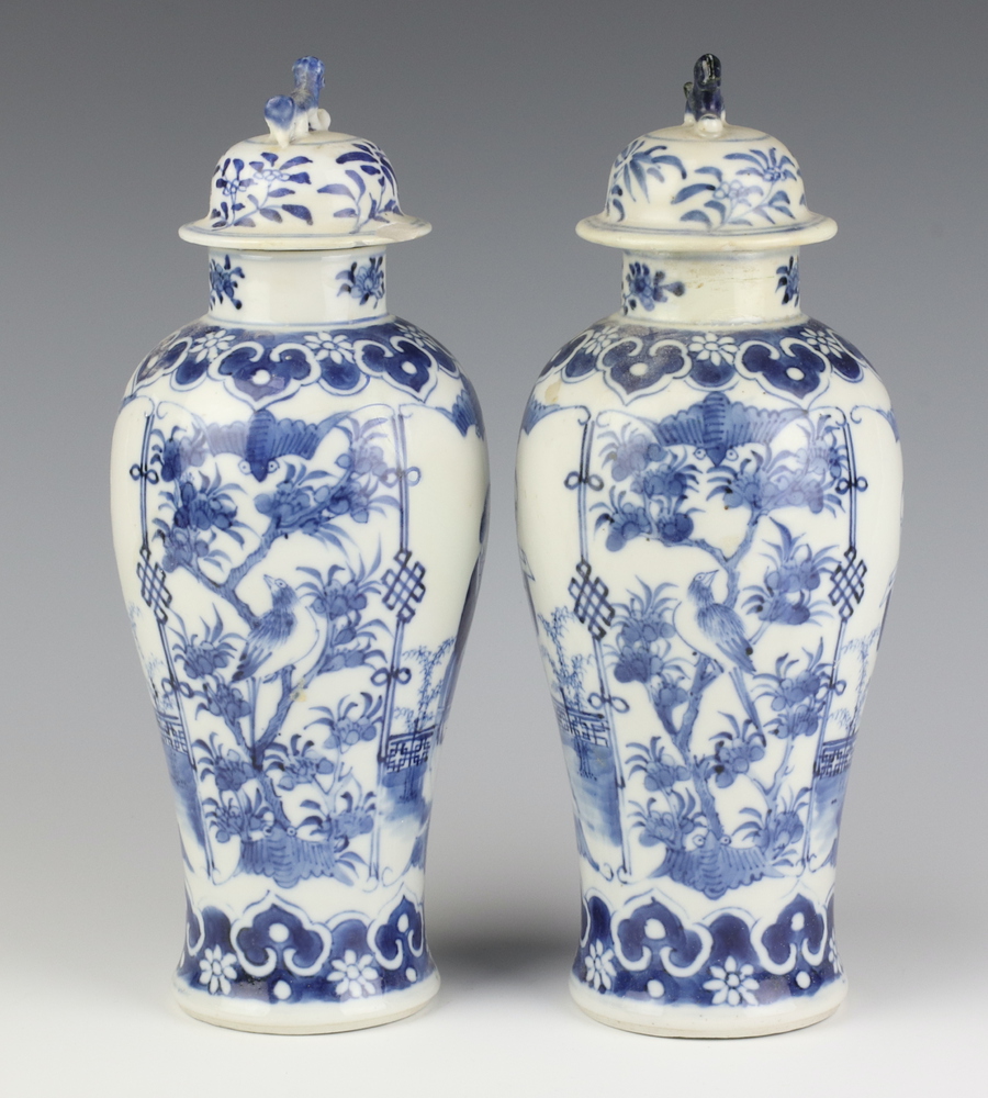 A pair of Chinese 19th Century blue and white oviform vases decorated with figures on a balcony with - Image 4 of 6