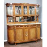 A French 19th Century walnut dresser with raised mirrored back fitted a shelf and enclosed by