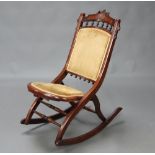 A 19th Century mahogany folding rocking chair with bobbin turned decoration 87cm h x 74cm w x 40cm d