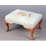 A hardwood stool with Berlin woolwork seat and armorial decoration to the centre, 30cm h x 56cm w
