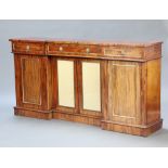 A Regency mahogany inverted breakfront sideboard fitted a drawer above double cupboard enclosed by