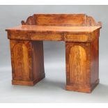 A William IV mahogany pedestal sideboard with raised back, the base fitted 1 long and 2 short