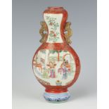 A 19th Century Qing Dynasty famille rose wall vase of bottle shape with gilt dragon handles, with