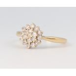 A yellow metal 18ct diamond cluster ring, approx. 0.5ct, 3.4 grams, size P