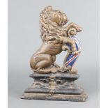 A cast iron doorstop in the form of a rampant lion 37cm h x 25cm w x 7cm d