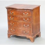 A Georgian style serpentine fronted, crossbanded mahogany chest with brushing slide and 4 long