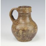 A 17th/18th Century tiger ware jug 13cm There is a chip to the lip