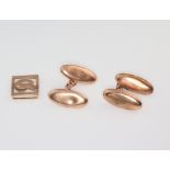 A pair of 9ct yellow gold cufflinks and a 9ct yellow gold clip, 7 grams