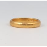 A yellow metal 22ct wedding band, size N, 5.4 grams