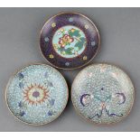 Three circular Japanese cloisonne enamelled saucers with floral decoration 10cm diam.