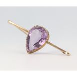 A yellow metal 9ct pear cut amethyst brooch 4.3 grams, 4.5cm