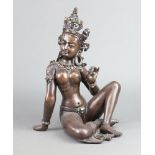 A bronze figure of a seated Indian Goddess 35cm x 26cm x 23cm