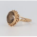 A 9ct yellow gold smoky quartz ring, size L, 2.7 grams