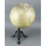 A.N. Lebegue & Cie, a 19th Century terrestrial globe raised on an iron stand with mask and paw feet,