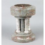 A carved Cornish serpentine miniature font 32cm h x 24cm diam. There is a 3cm chip to the top