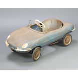 A Triang Jaguar E-Type pressed steel pedal car The car is rusted, missing a head lamp, covers and