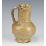 A 17th/18th Century tiger ware baluster jug 18cm There are 2 firing cracks to the lip