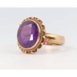A yellow metal oval amethyst ring, size P, 4 grams gross