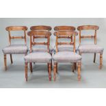 A set of 6 Georgian carved mahogany bar back dining chairs with shaped mid rails and overstuffed