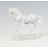 A Swarovski Crystal figure of a standing horse raised on an octagonal base 9cm