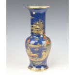 A Carlton Ware blue ground baluster vase with chinoiserie decoration, figures in extensive landscape