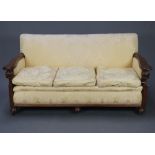 A 1930's oak show frame three piece settee suite comprising three seater settee and two matching