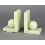 A pair of Art Deco onyx bookends with ball decoration 14cm h x 10cm w x 8cm d The balls have been