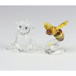A Swarovski Crystal figure of a bee sitting on a flower 5.5cm, ditto of a seated chimpanzee 4.5cm,