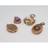 Two 9ct yellow gold lockets, a pendant and seal, gross weight 25 grams