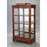 A Biedermeier style mahogany bookcase fitted adjustable shelves, the stepped top fitted a secret