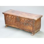 A 16th Century and later Century Spanish Gothic carved fruitwood coffer with iron hinged lid and