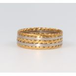 A 2 colour yellow and white metal wedding band, the white metal stamped 18ct, 4.2 grams, size P