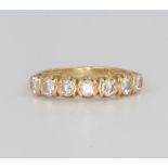 An 18ct yellow gold 7 stone diamond ring, approx. 0.70ct, size I 1/3, 3 grams