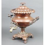 A Regency copper twin handled tea urn with brass spicket raised on a shaped base 42cm x 38cm