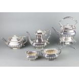 An Edwardian silver plated demi-fluted tea and coffee set comprising tea kettle on stand with