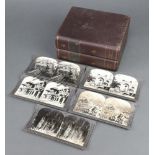 A collection of Underwood and Underwood stereoview slides of India contained in a faux burgundy book