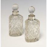 A near pair of heart shaped cut glass silver mounted scent bottles Birmingham 1897