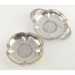 Two silver coin set dishes London 1909 and Birmingham 1913, gross weight 96 grams, 7cm