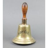 A brass hand bell with turned wooden handle, the bell marked Burfields 27cm h x 15cm diam.
