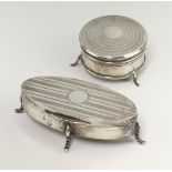 An oval silver trinket box raised on cabriole legs Birmingham 1920 11cm, a circular ditto Birmingham