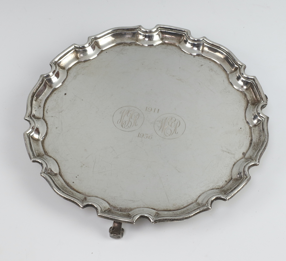 An Art Deco silver card tray with pie crust rim and engraved inscription Birmingham 1933, 20cm,