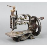A Victorian manual sewing machine 20cm x 22cm x 9cm The moving parts are free and running