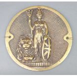 A circular cast brass plaque decorated a figure of Britannia and lion 22cm
