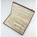 A cased set of German eaters with repousse 800 handles