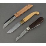 A Conaz Inox folding pocket knife with 7cm blade, wooden grip marked Conaz Inox Scarperia, a
