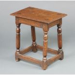 A Utility 17th Century style oak joined stool, raised on turned and block supports with box framed