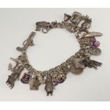 A silver charm bracelet 69 grams